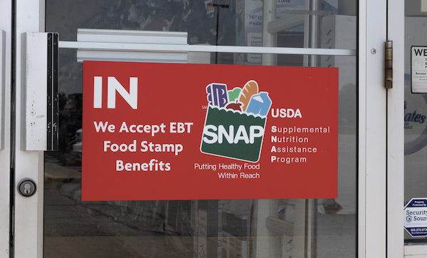 Gas City - July 22, 2025: SNAP and EBT Accepted here sign. SNAP and Food Stamps provide benefits to help the budgets of disadvantaged families.
