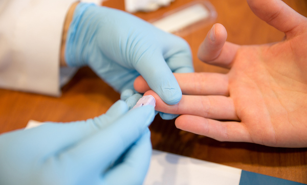 Patient getting a blood test from a doctor