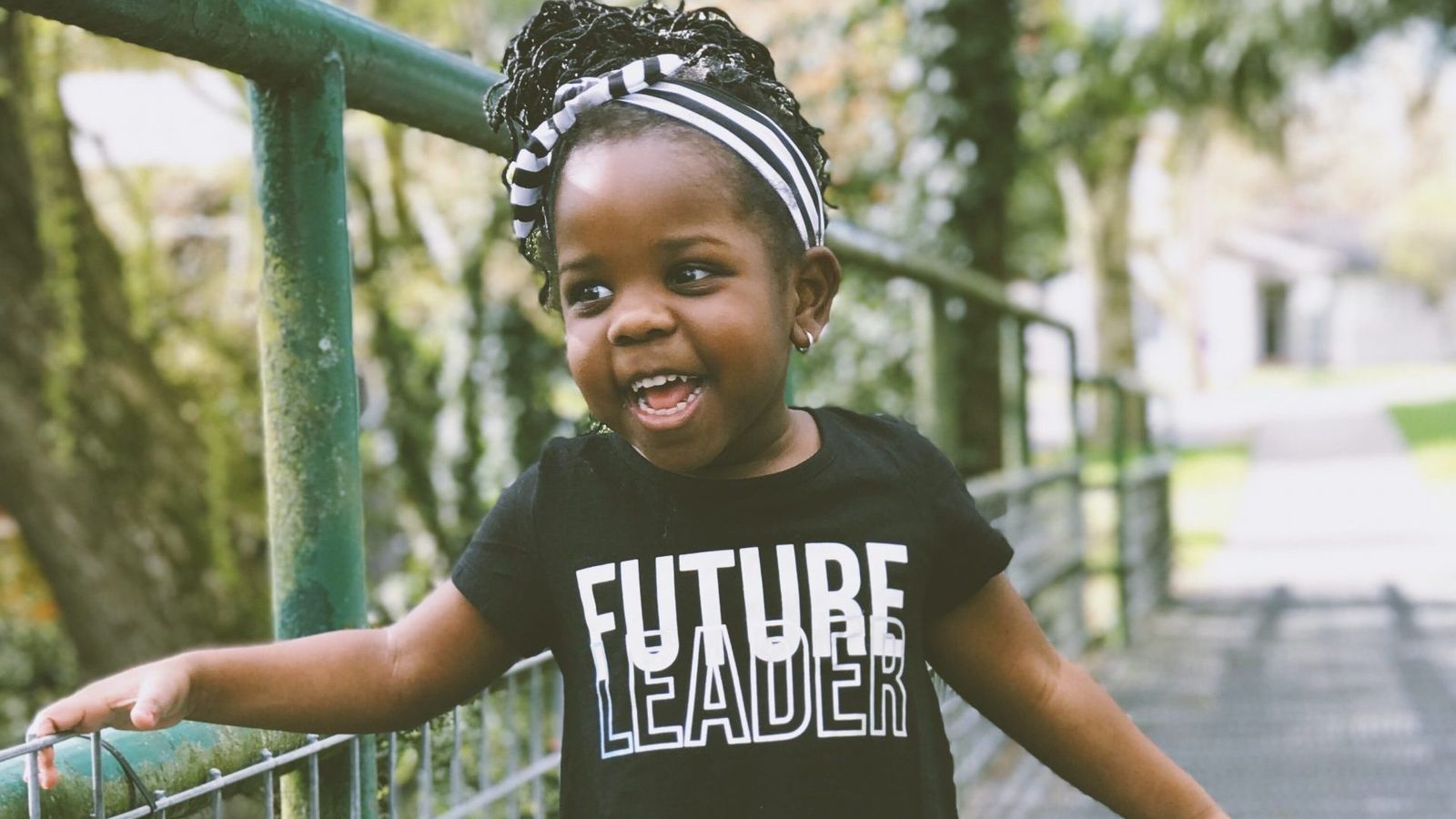 black-youth-smiling-on-bridge