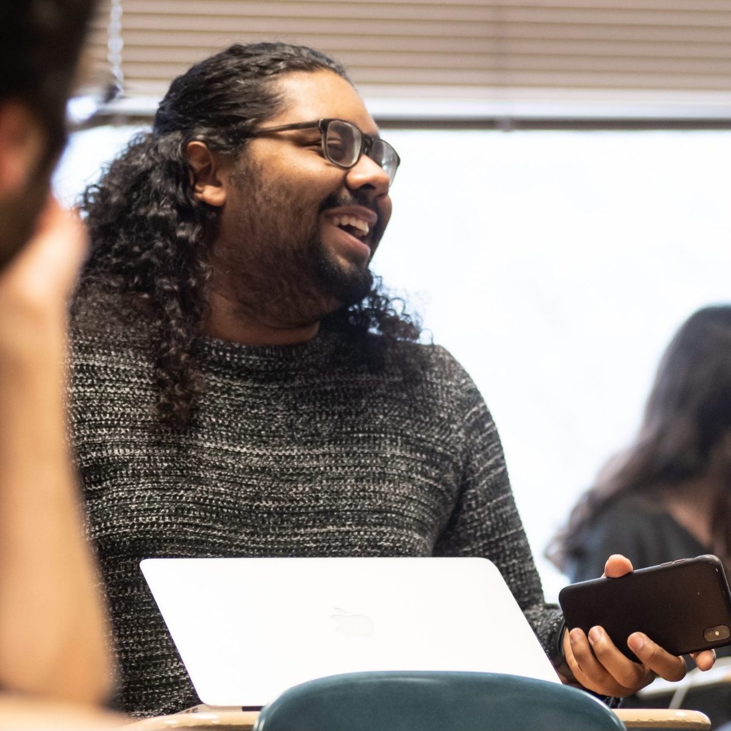  a student laughs in class 