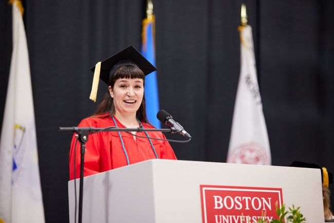 A student speaker addresses the audience