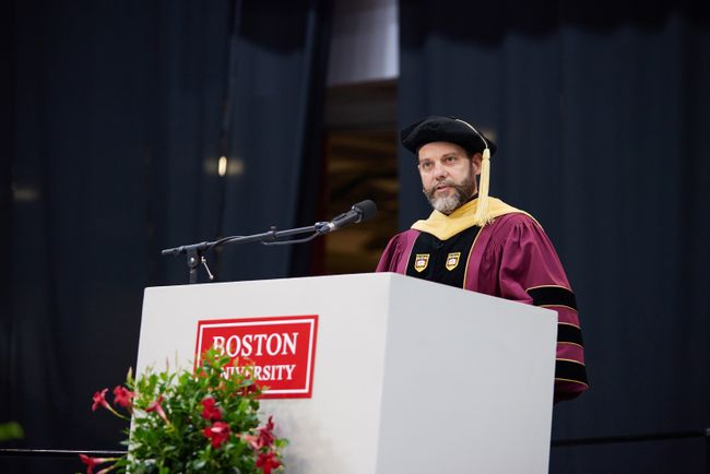 Assistant Dean Wade Taylor is at the podium to announce the teaching excellence award