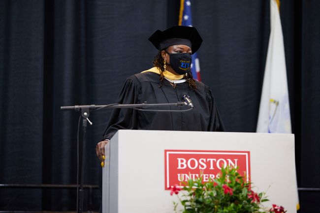 Assistant Dean Denita Johnson presents the class gift to the Judith Perlstein Field Education Fund