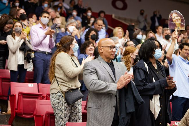Guests clap from the stands