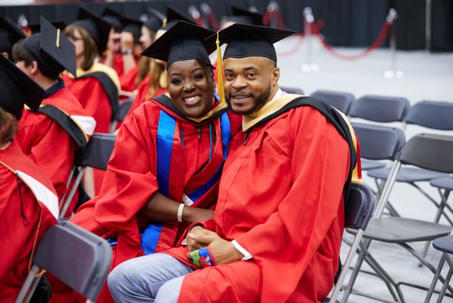 Grads smile for a picture