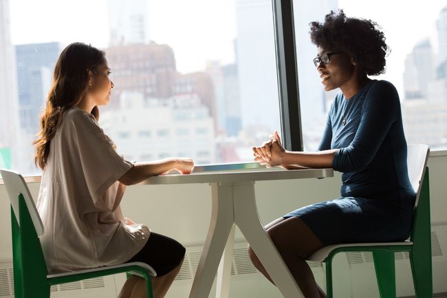 two women talk to each other
