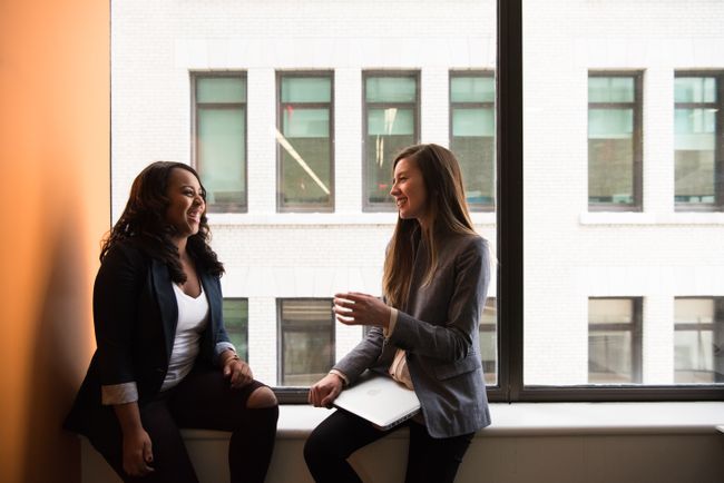 two business partners converse