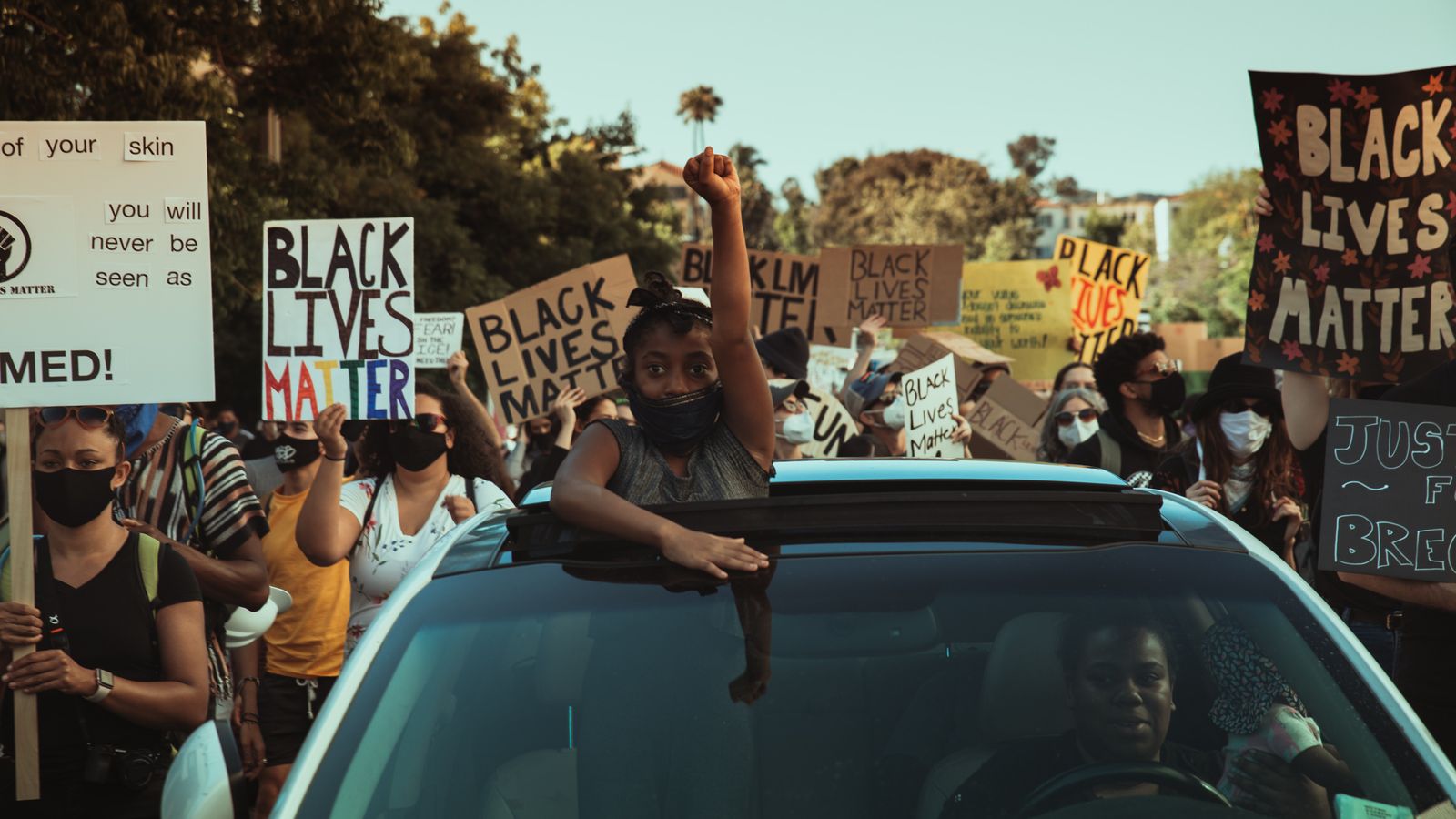 child participates in black lives matter protest