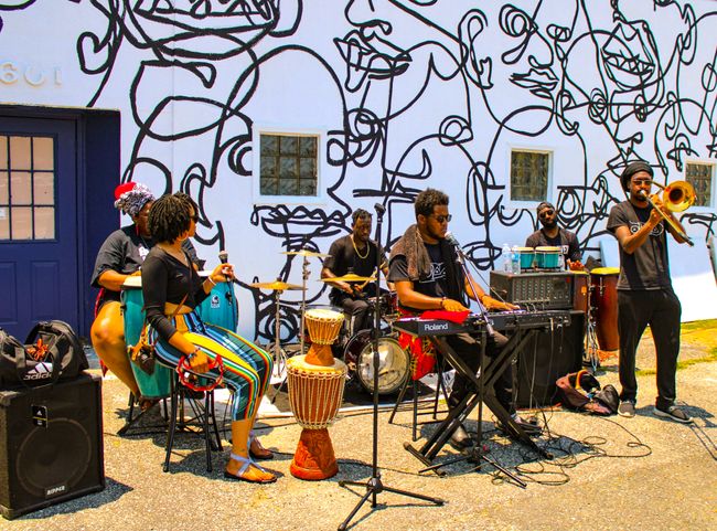 Photo of a band playing a outdoor concert