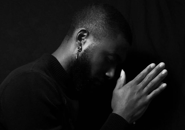 black man praying
