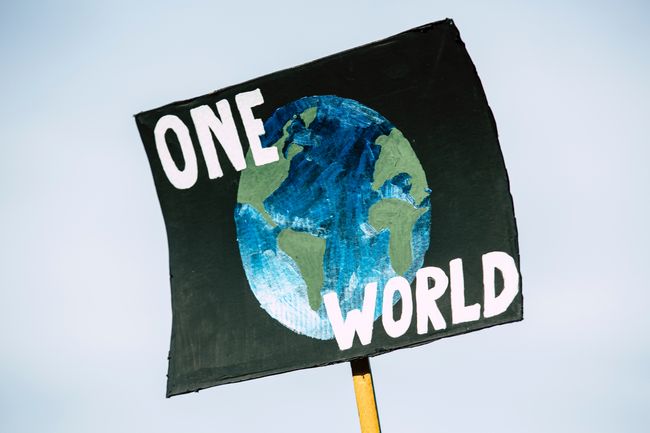 One World climate justice sign