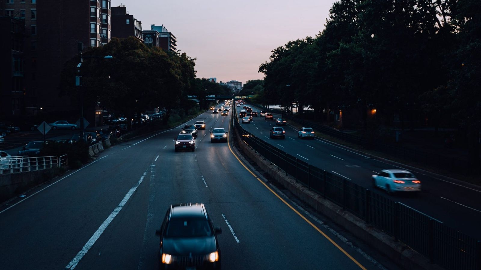 cars driving on a highway at night