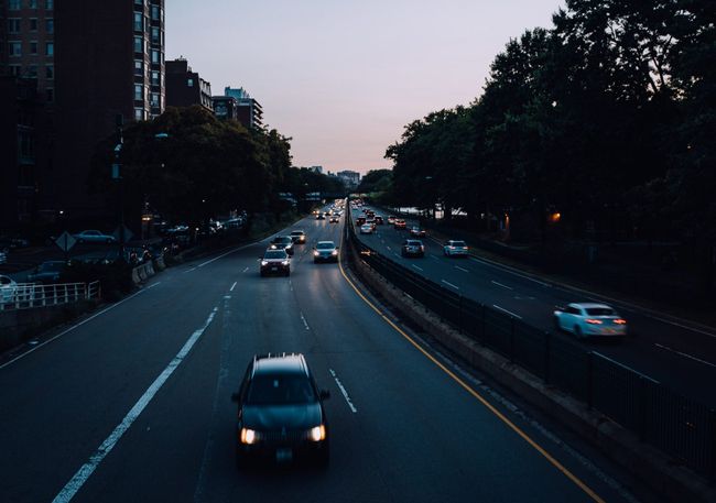 cars driving on a highway at night