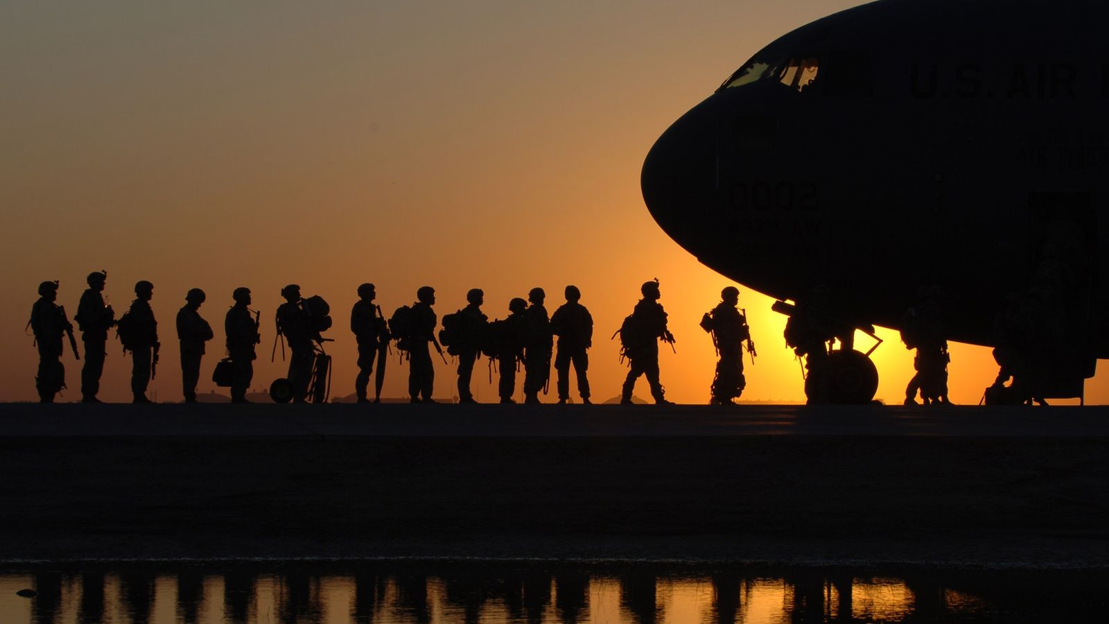 soldiers boarding a plane