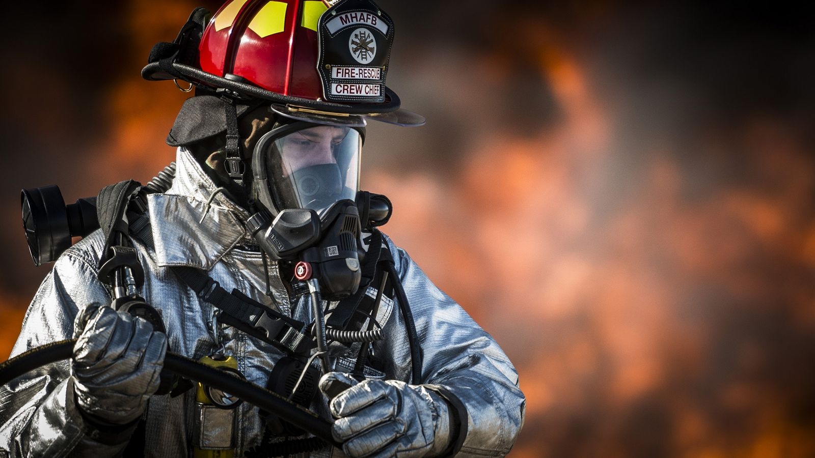 a firefighter wearing a gas mask