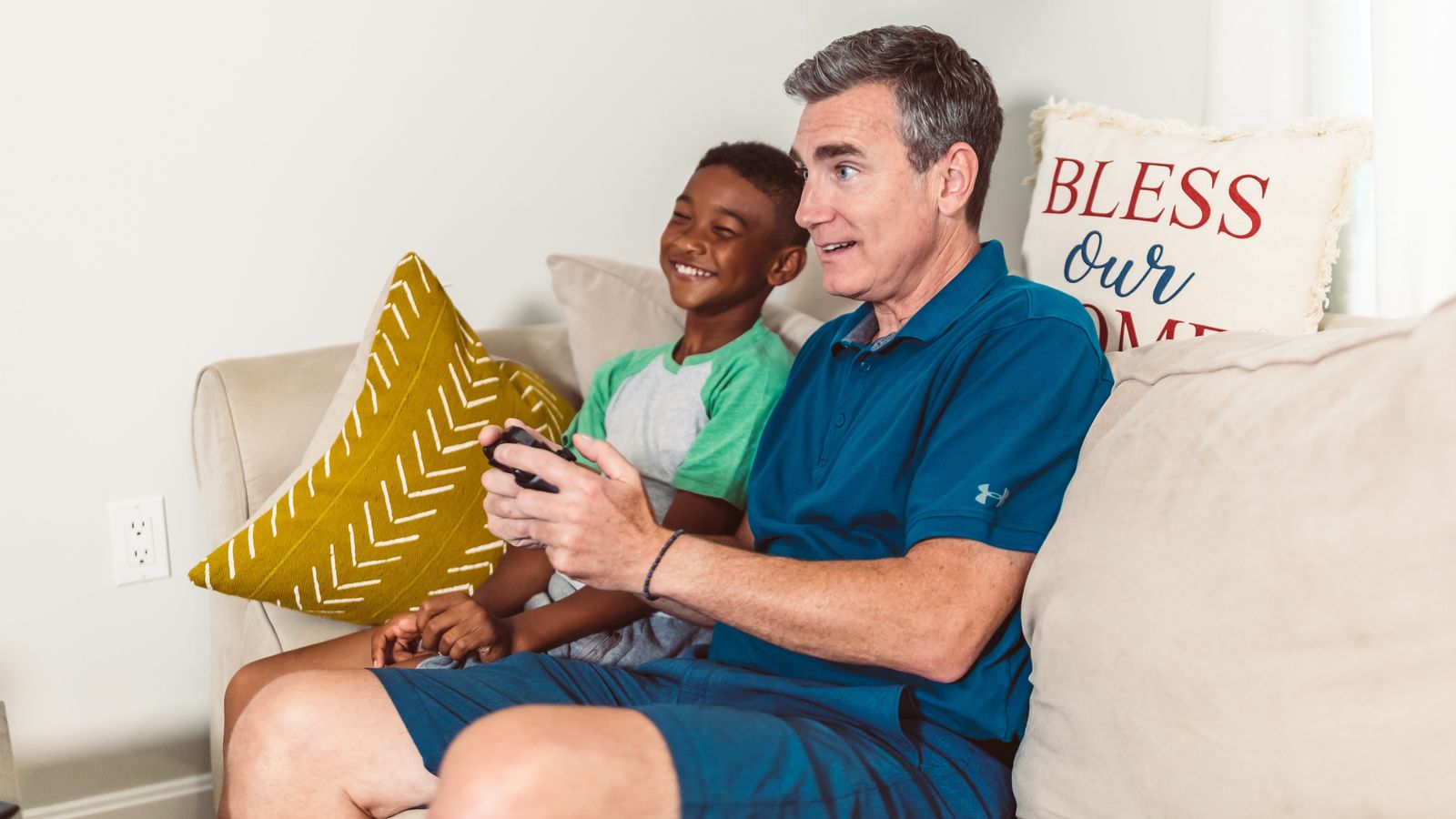 mentor plays video games with child