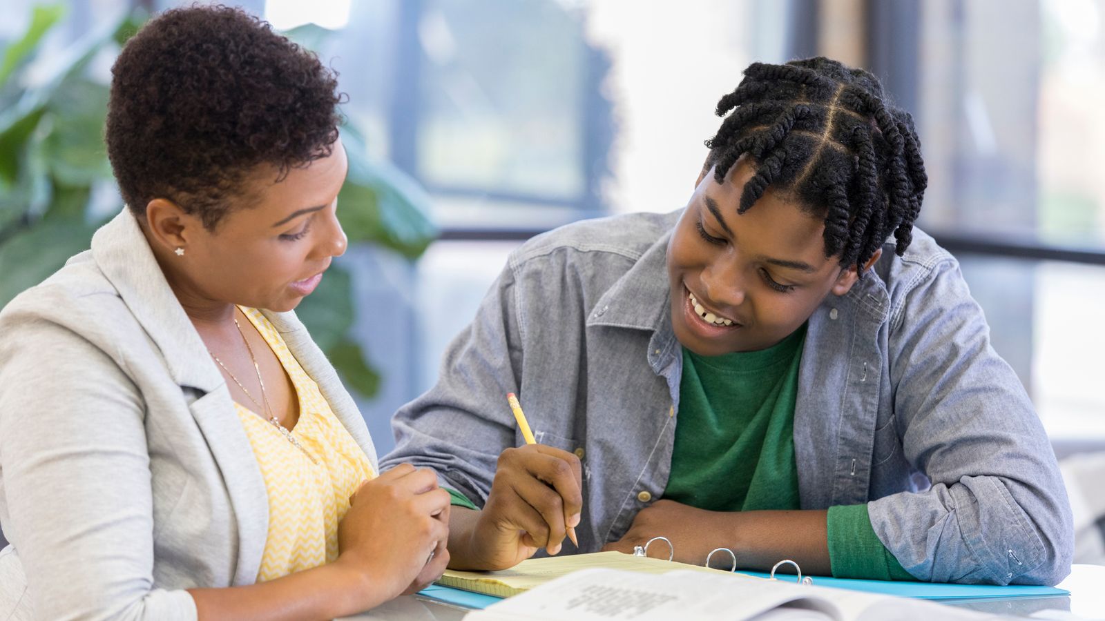 a teacher helping a student