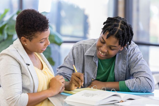 a teacher helping a student