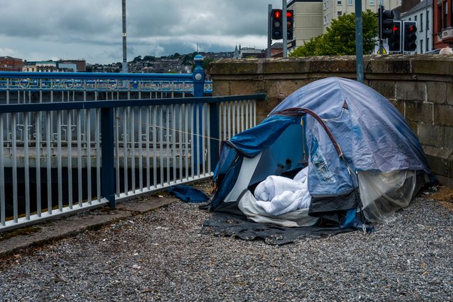 tent in urban area by river
