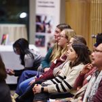 Photo of event audience looking at stage