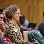 Photo of audience member smiling