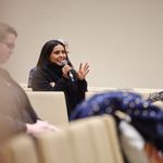 Photo of audience member asking a question during the Q&A