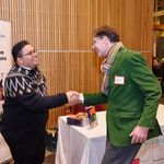 Photo of Prof. Alvarez-Hernandez shaking hands with attendee during book signing