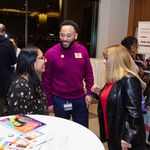 Audience members in conversation during the reception