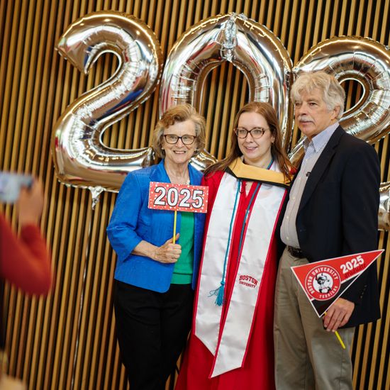 Graduate with her family at commencement reception
