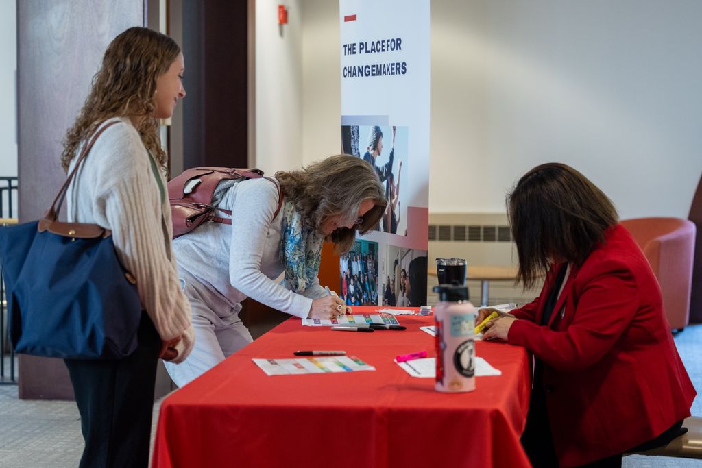 workshop attendees checking in at table