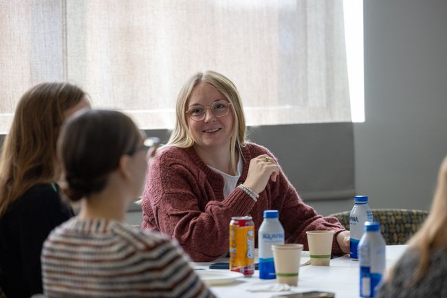 workshop attendees interacting at table