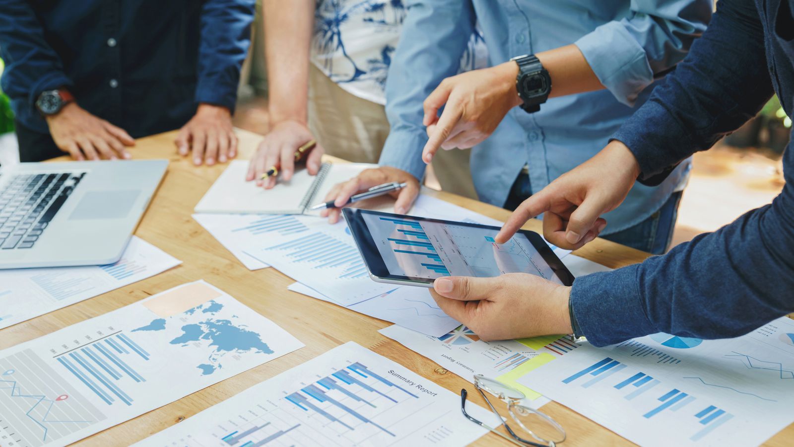 team viewing charts and graphs for project