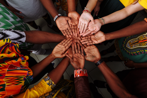 Palms outstretched in support African communities