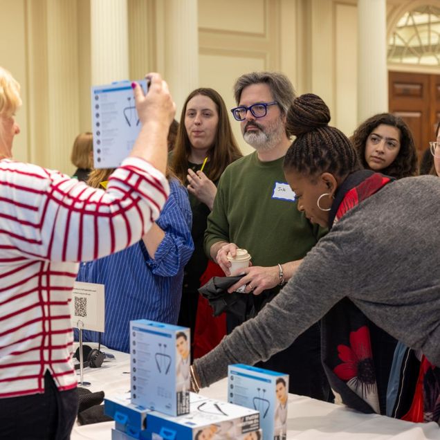 Image of Staff Members picking free electronic giveaways