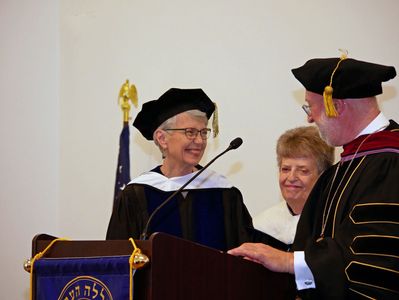 STH Dean Mary Elizabeth Moore receives her honorary degree from Rabbi Or Rose during the Hebrew College Commencement Ceremony on Sunday, June 3, 2018.