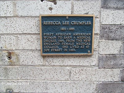 1864 - Plaque commemorating Dr. Rebecca Crumpler. Black plaque on grey brick wall