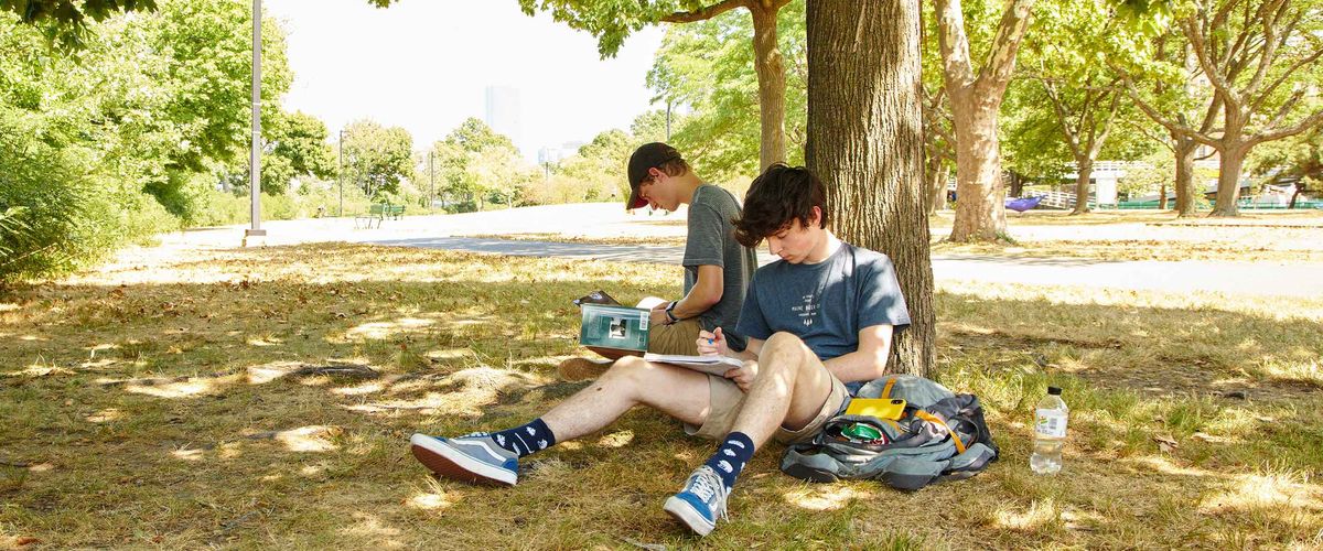 BU students studying on the Charles River Bike Path