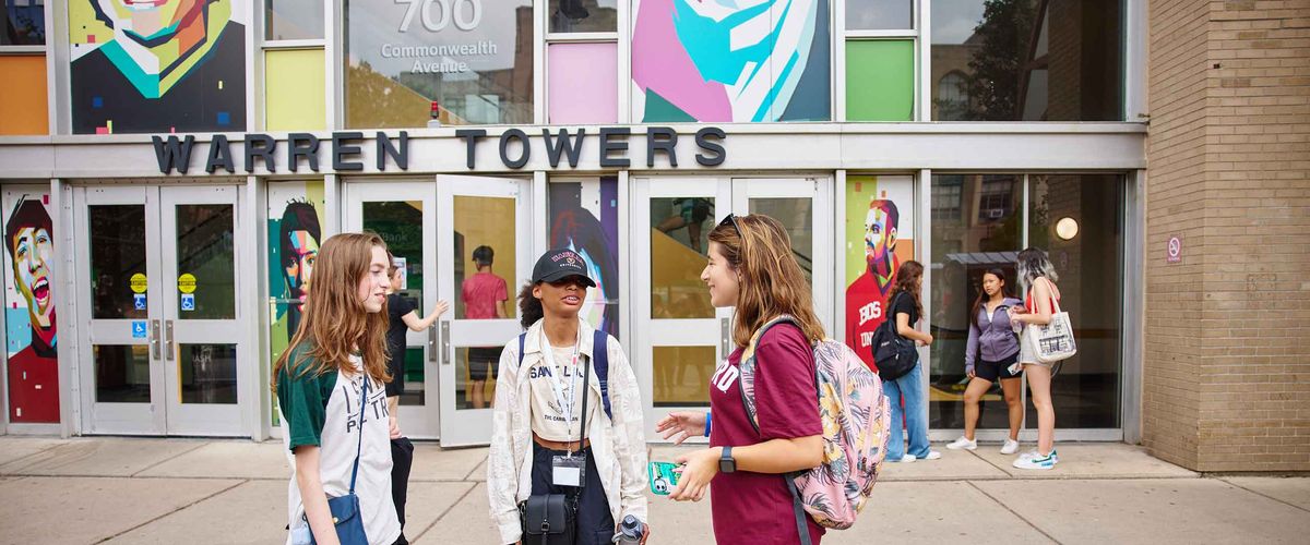 Boston University students standing in front of Warren Towers