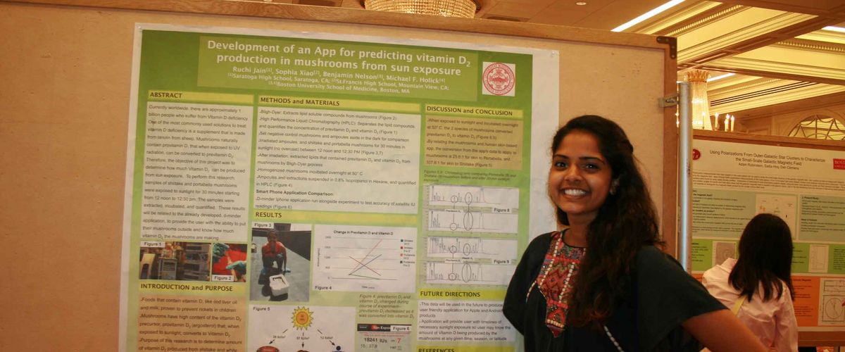 A student presenting at the RISE Poster Symposium