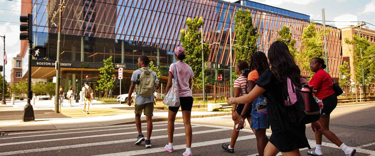Students crossing Commonwealth Ave, walking towards the BU Center for Computing & Data Sciences