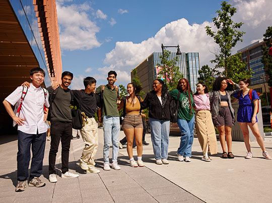 A group of students posing in front of the BU Center for Computing & Data Sciences