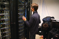 Boston University undergraduate students Michael Abed, Darko Stosic, Dusan Stosic, and Terry Black preparing for the SC11 Student Cluster Competition