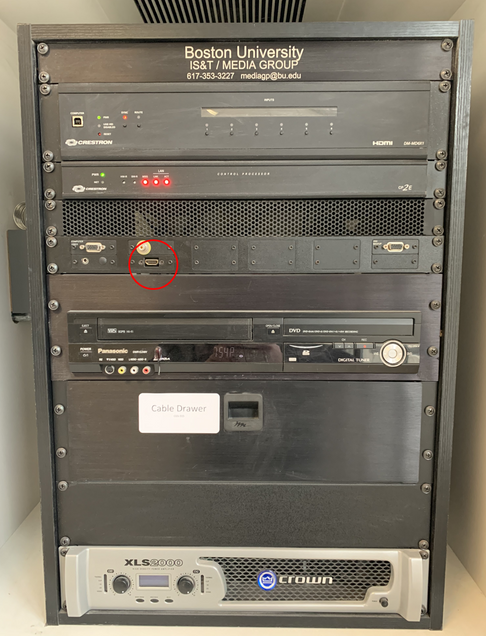 Shows large black AV rack with the HDMI port in the center