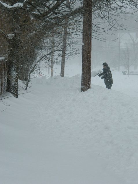 Linda's husband shoveling