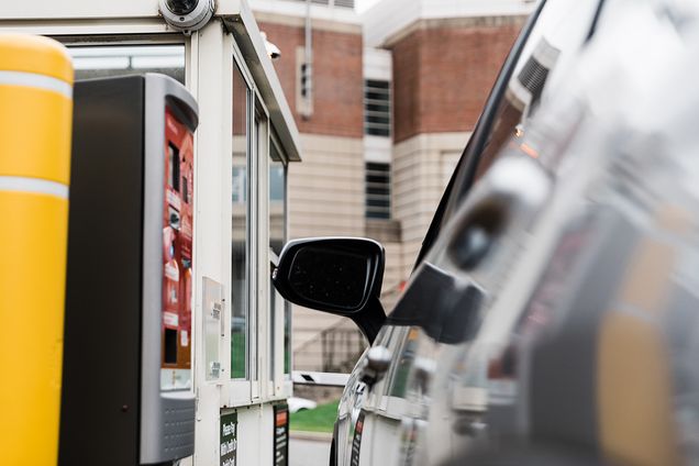 Gate and booth at parking garage entrance