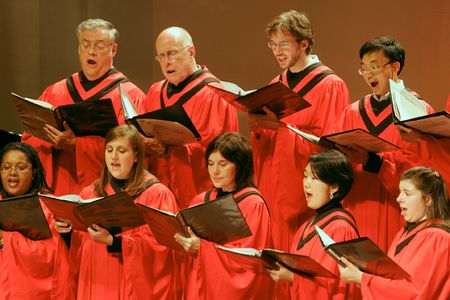 Choral singers in red robes