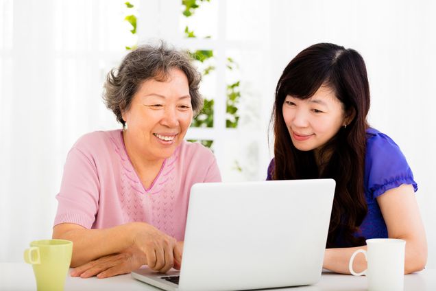 happy senior Mother and daughter learning laptop