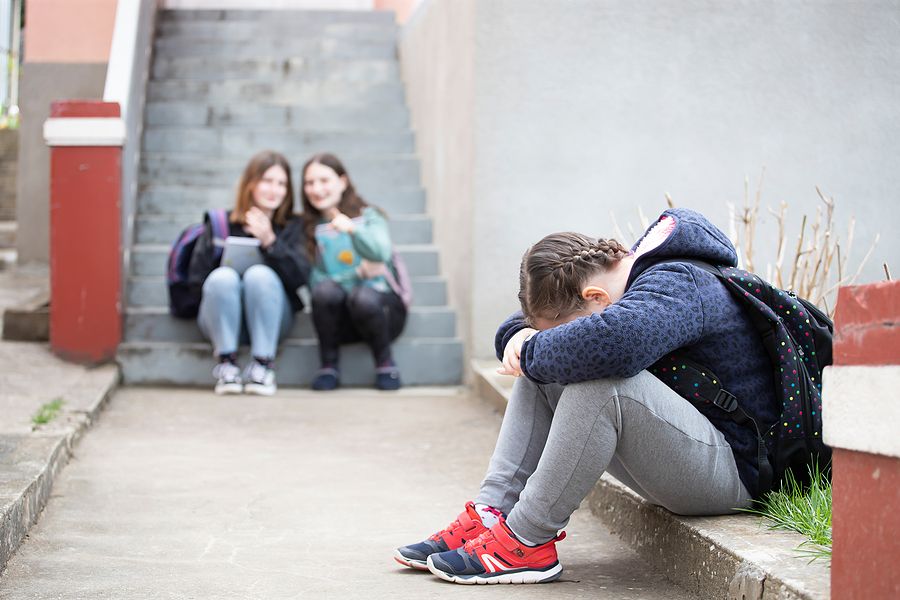 Girl being bullied at school.