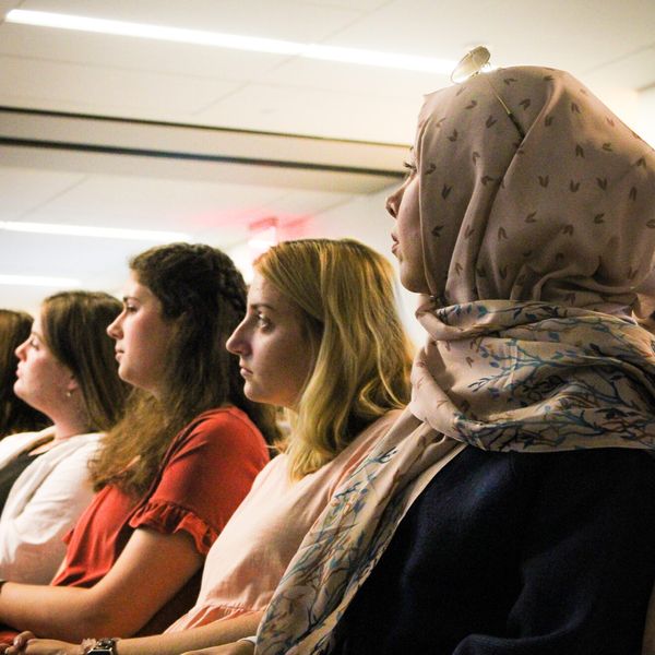 Female students looking forward during seminar
