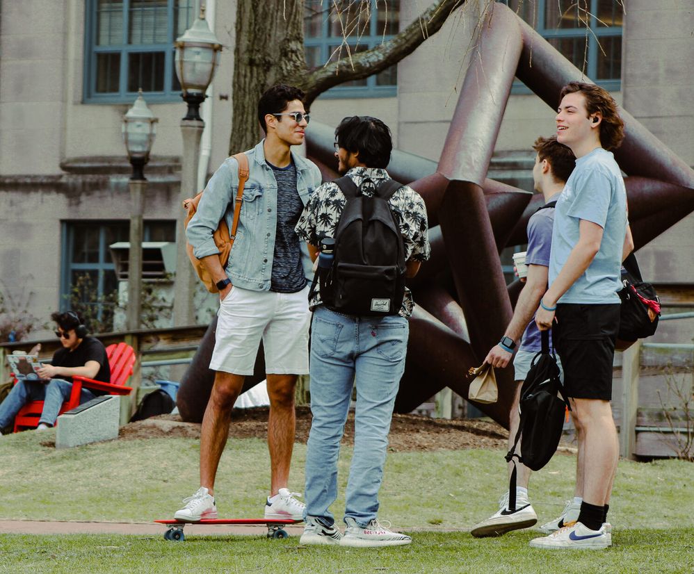 Four Students talking on BU Beach